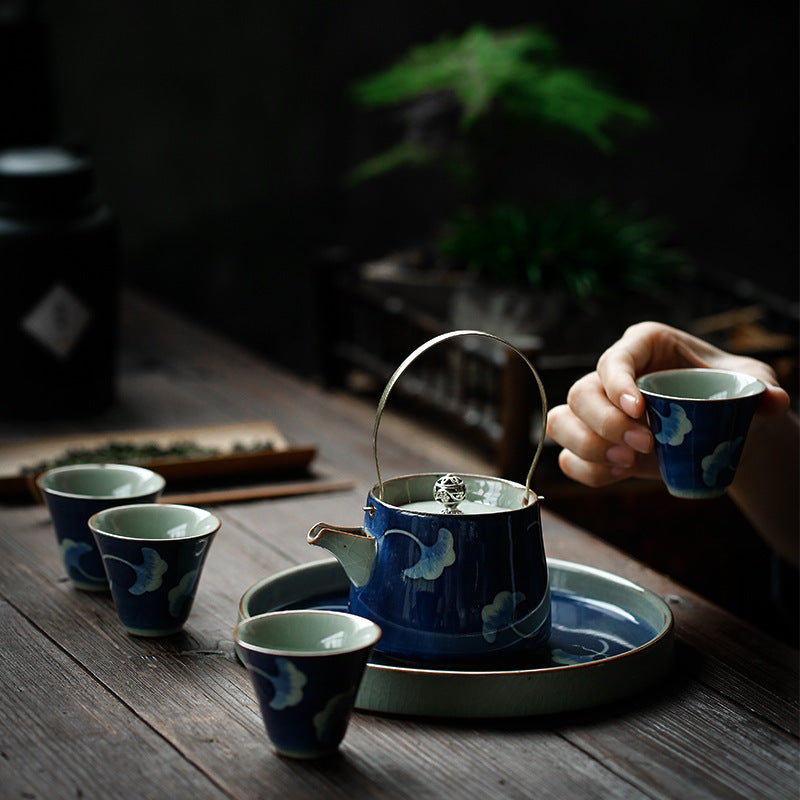 Hand-painted ceramic teapot with blue glaze finish