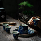 Hand-painted ceramic teapot with blue glaze finish