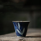 Hand-painted ceramic teapot with blue glaze finish